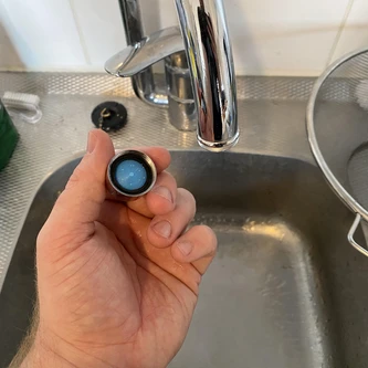 Showing screw-on filter of water tap