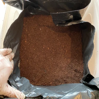 Showing top layer of just coir inside the tub